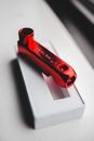 Small red skate key pipe placed on table