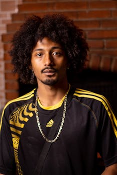 Portrait of a stylish man with afro hair in São Paulo, highlighting urban fashion.