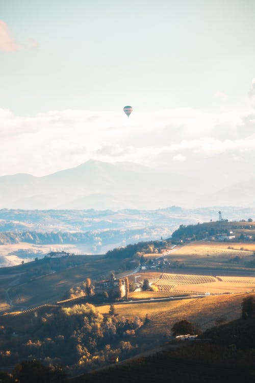 Hot Air Balloon Flying over the City