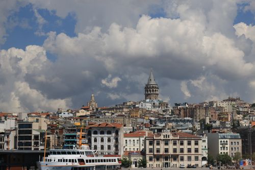 Free Scenic view of Istanbul's skyline dominated by the historic Galata Tower under a cloudy sky. Stock Photo