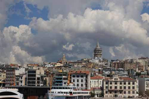 Free Explore the stunning view of Istanbul with Galata Tower and vibrant city architecture beneath dramatic clouds. Stock Photo