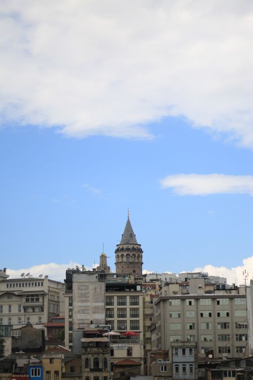 Free Scenic view of the Galata Tower amid a classic Istanbul cityscape under a clear blue sky. Stock Photo