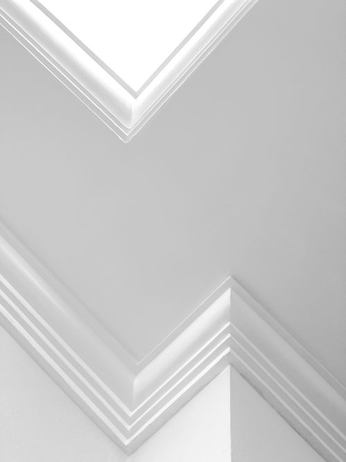 Free White modern ceiling with geometric shapes and clean lines, showcasing contemporary design. Stock Photo