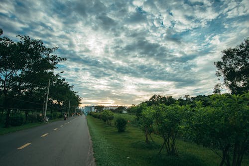 Free Photo of Roadway Under Cloudy Sky Stock Photo