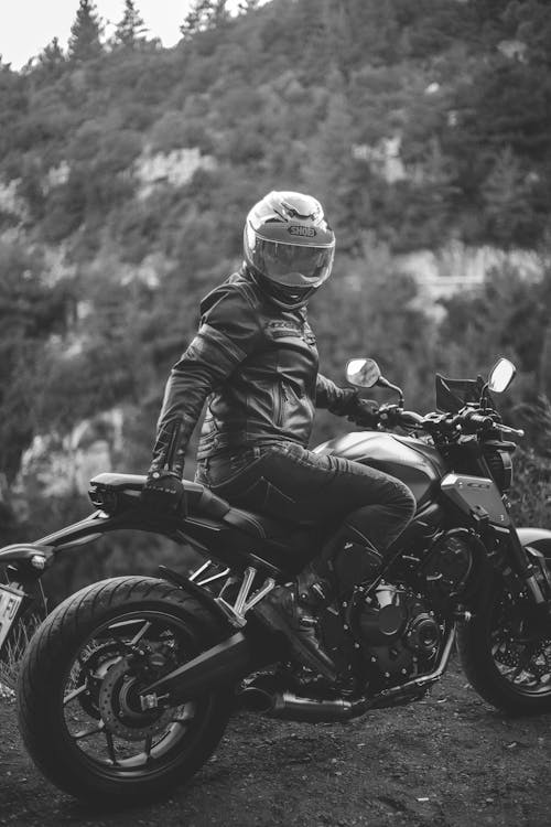 Free Grayscale Photo of a Man Riding Motorcycle Stock Photo