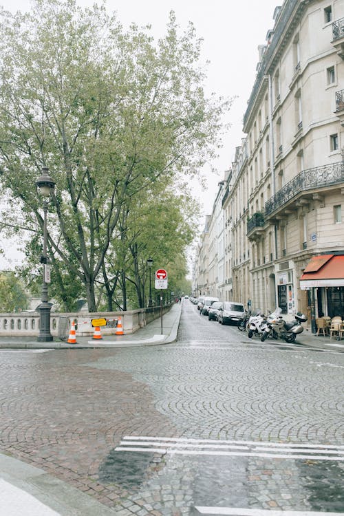 Cars Parked on Sidewalk Near Building