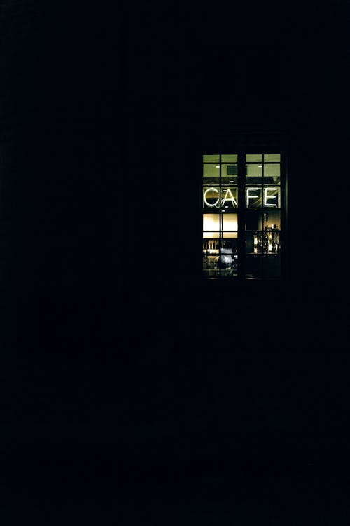 A Cafe Sign on a Coffee Shop at Night 
