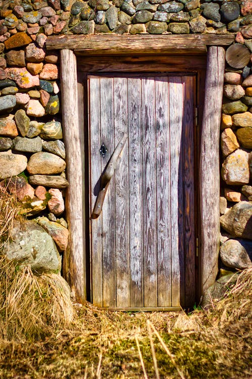 Free Wooden Door on a Stone House Stock Photo