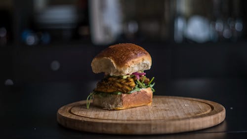 Burger on Brown Wooden Chopping Board