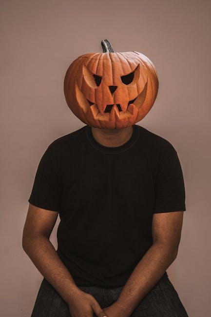 Man with a Carved Pumpkin on His Head