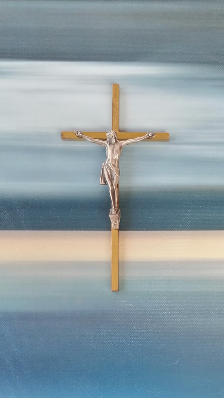 Crucifix On A Colorful Wall