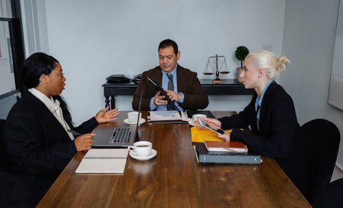 Free Group of smart diverse colleagues discussing new strategy of business Stock Photo