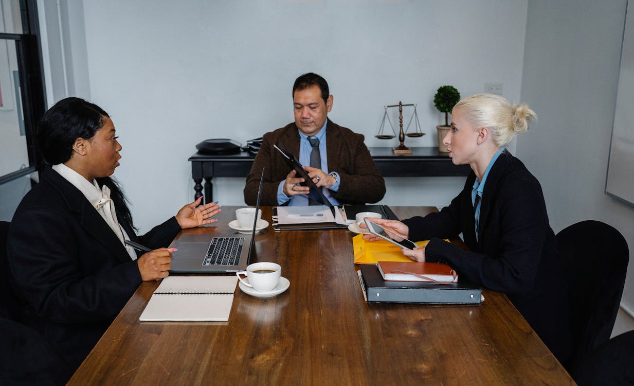 Free Group of smart diverse colleagues discussing new strategy of business Stock Photo