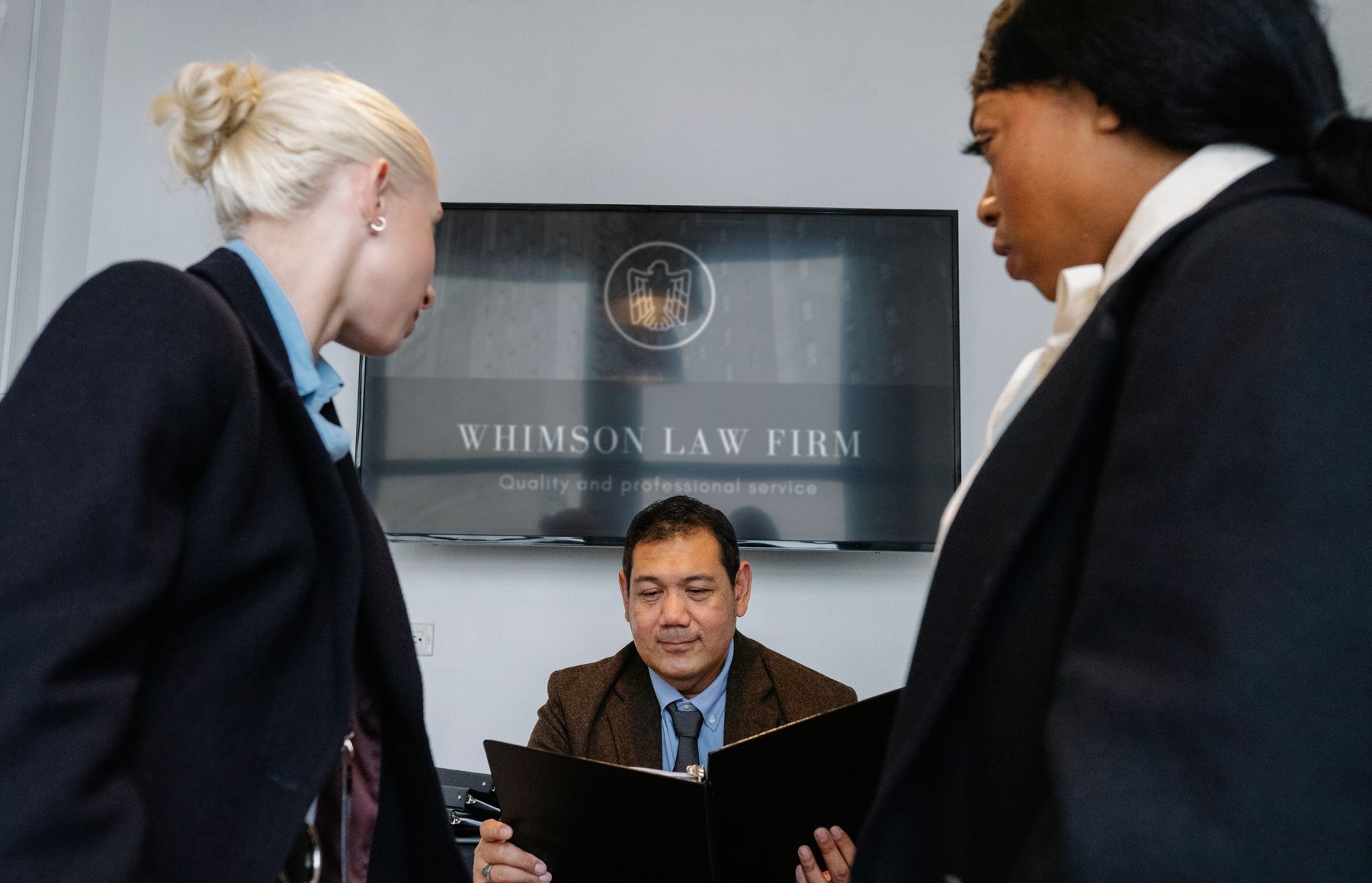 Legal and advisory professionals working together in a modern law firm office