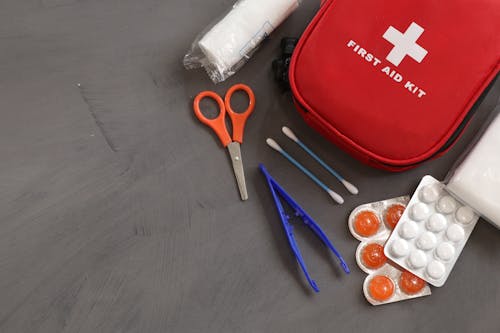 Free First Aid Kit on Gray Background Stock Photo