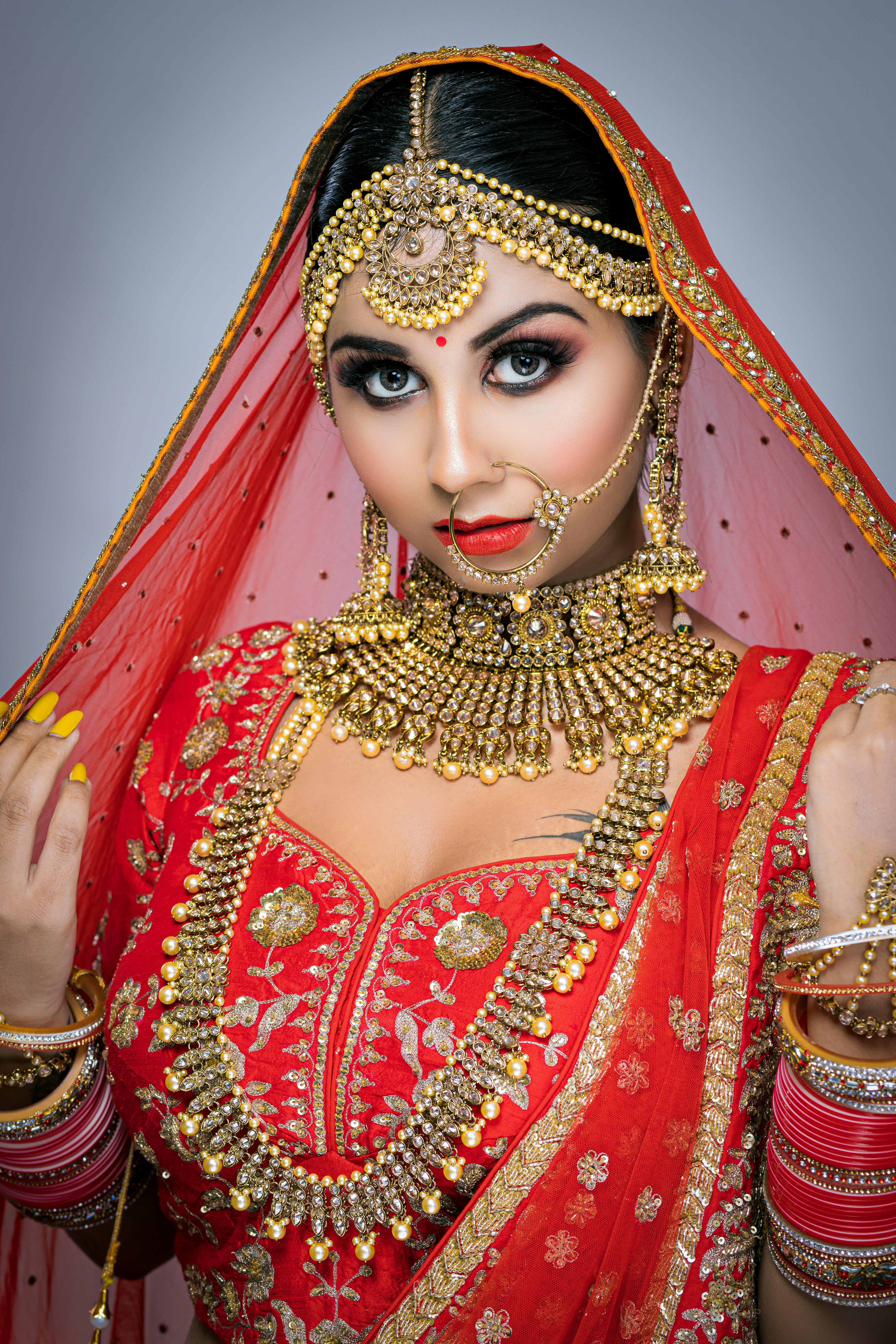 Woman in Red and Gold Sari Dress