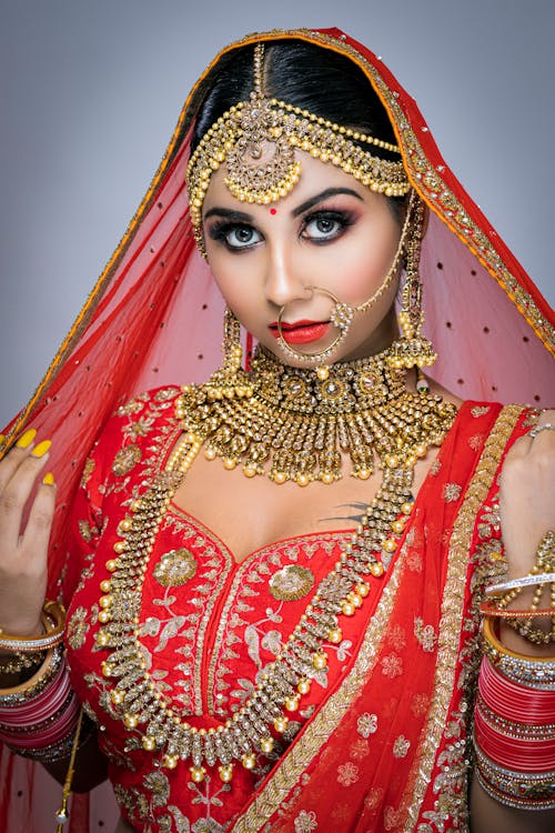 Woman in Red and Gold Sari Dress