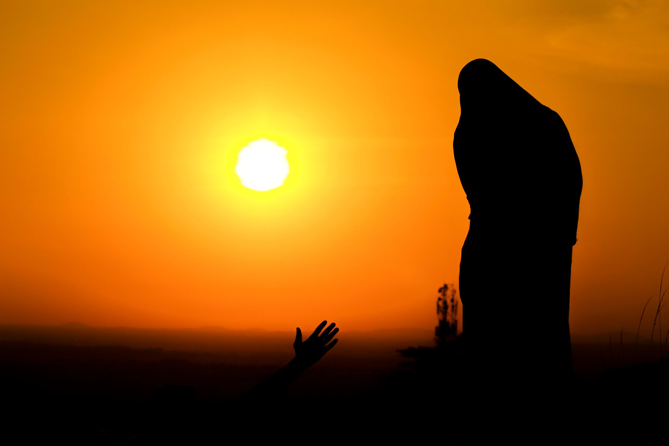 Silhouette of a Woman During Sunset · Free Stock Photo
