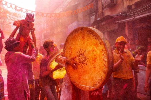 Joyful Holi celebration in Kolkata with colors, music, and festivities.