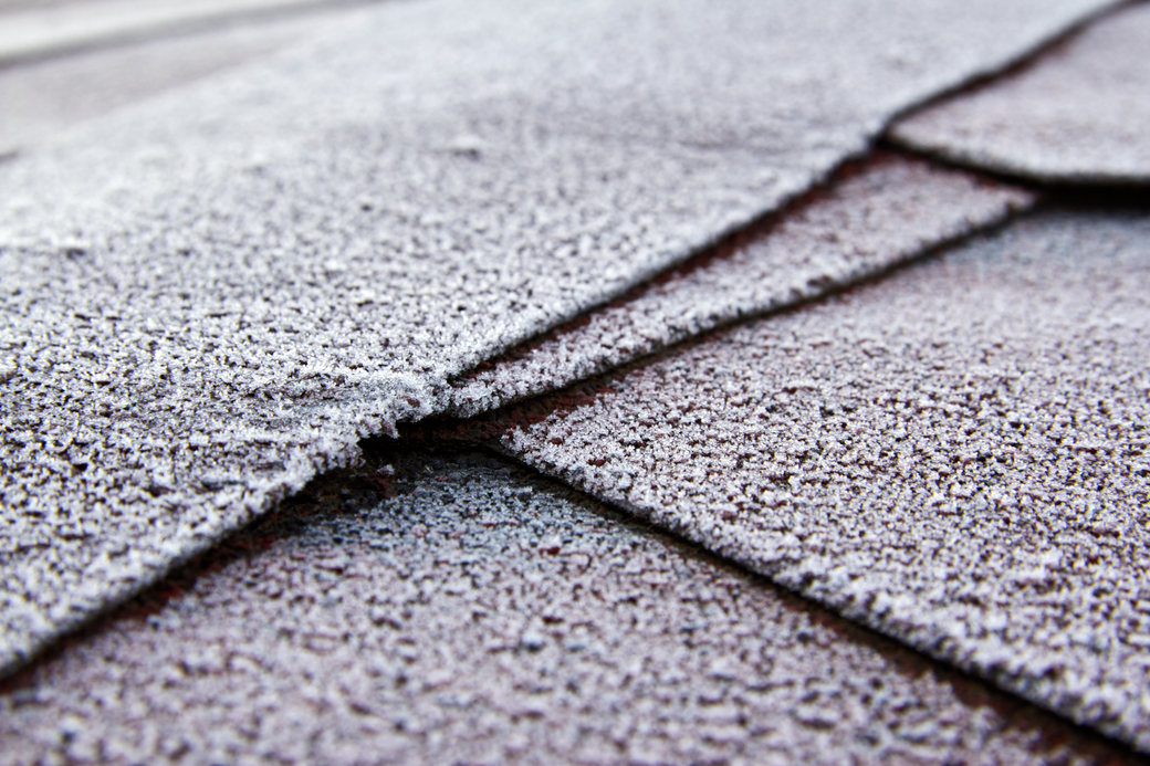 Close-up view of frost-covered roof shingles