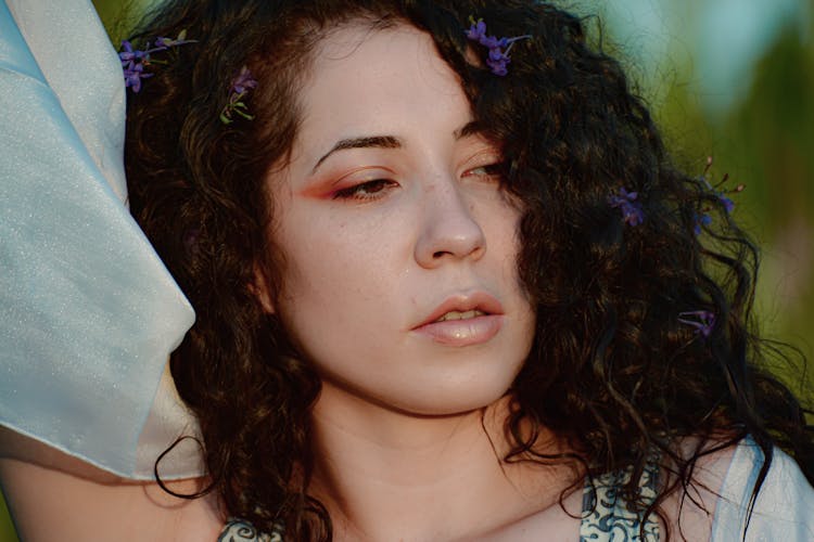 Crop Pondering Woman With Chiffon Scarf And Flowers In Hair