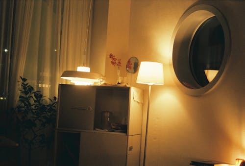 Lighted Lamp near Cabinet