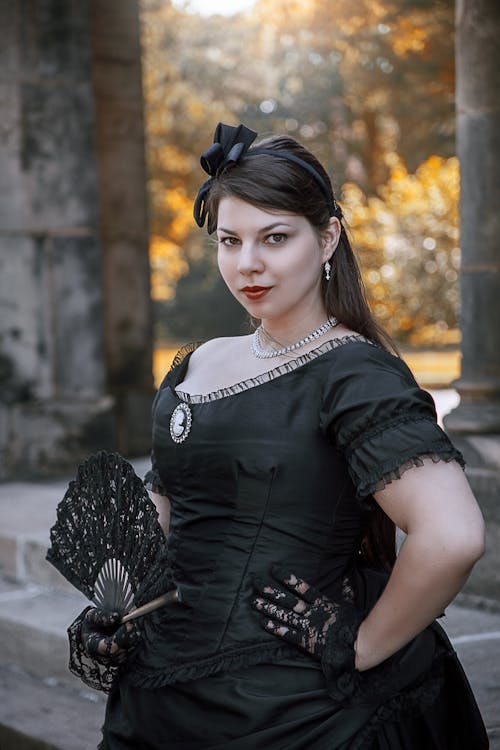 Close-Up Shot of a Beautiful Woman Wearing Black Dress