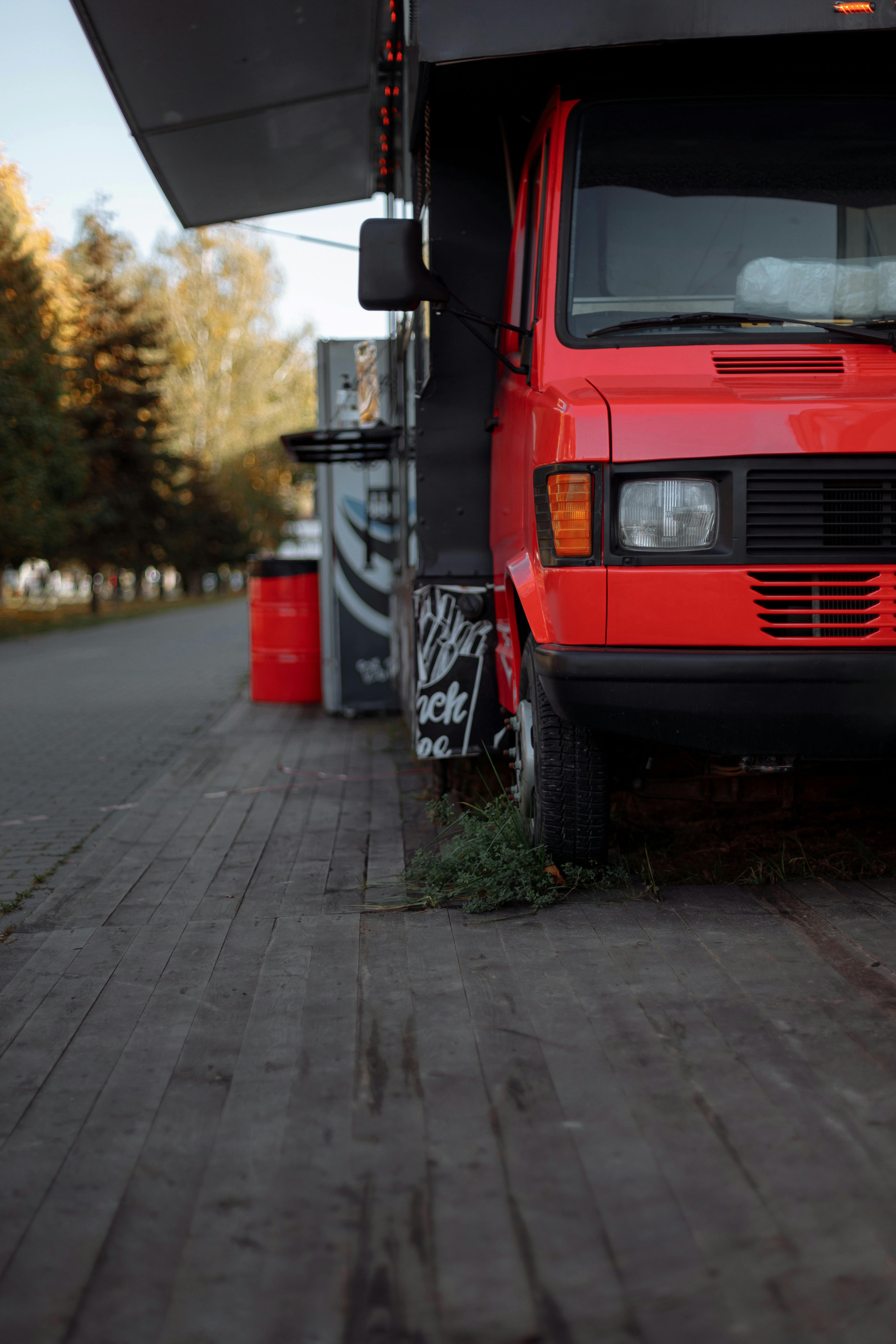 red and black car on road