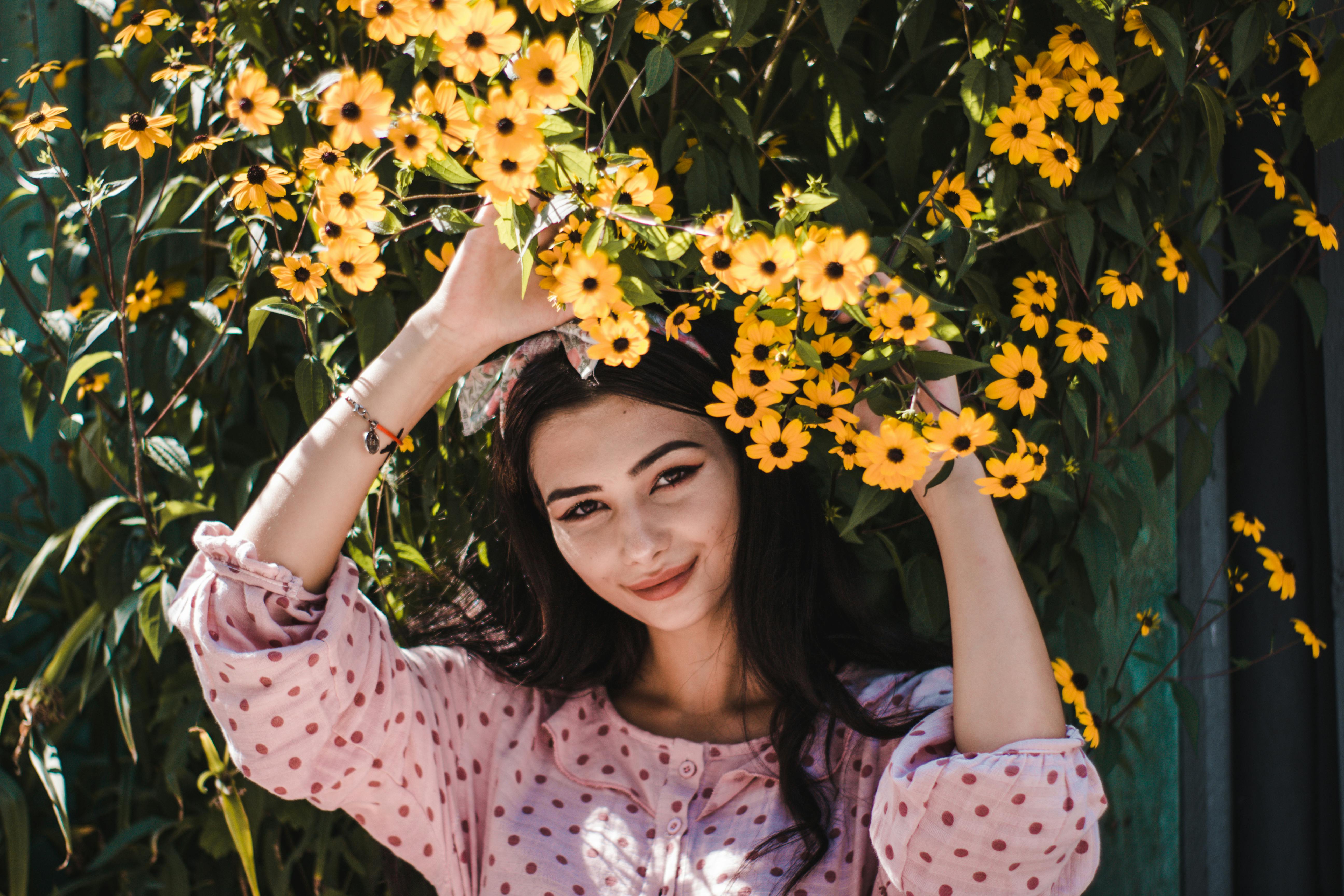 Woman with Arms Raised Standing on Lakeside · Free Stock Photo