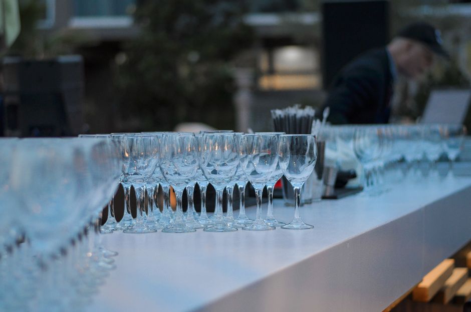 Rows of wine glasses set up at a bar for a Northern Virginia or DC event reception