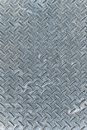 Background with gray steel plate with relief surface with fine repeating drop pattern of shabby metal structure with uneven texture