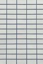 Background with white tiles on wall
