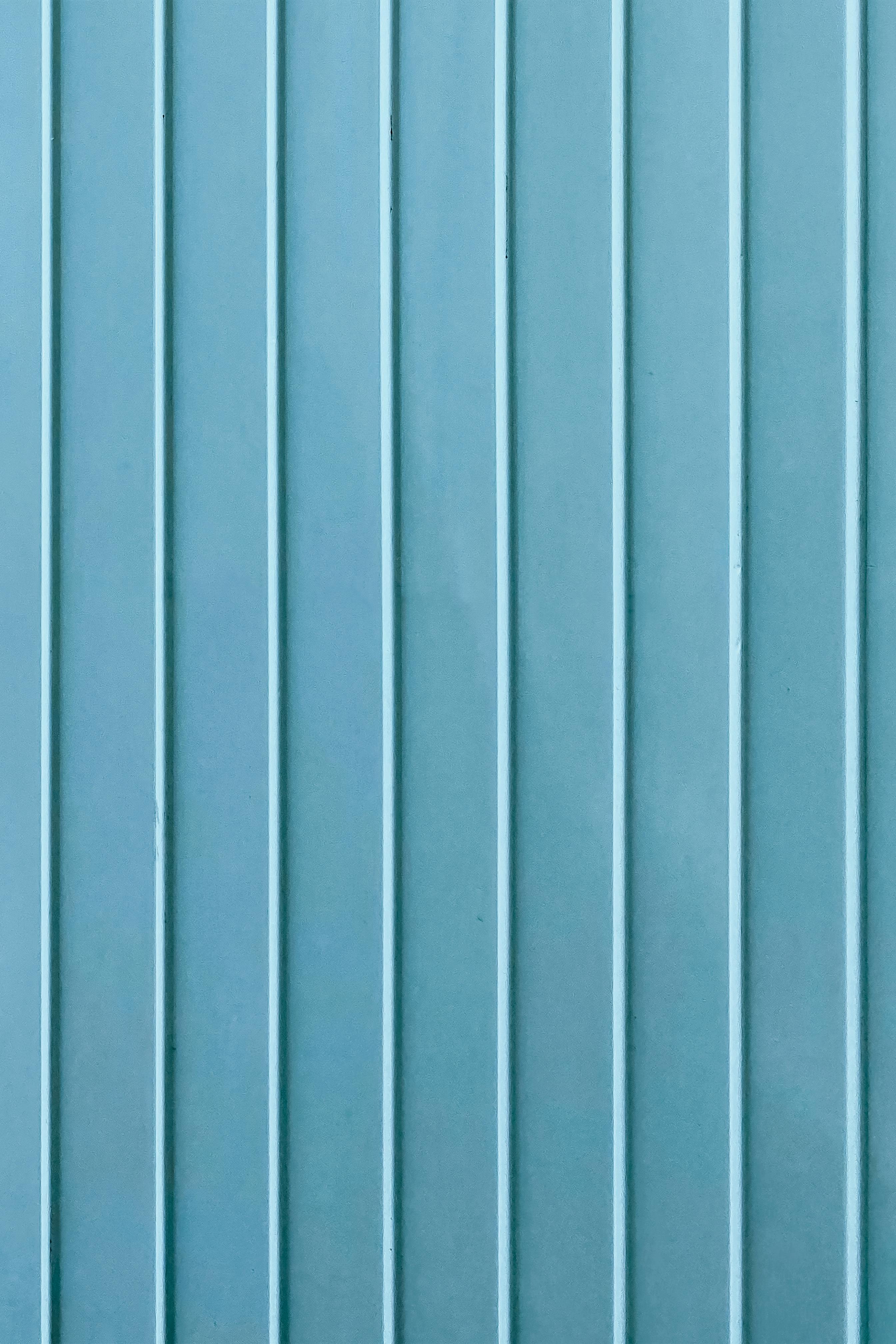 vertical lines on blue wall