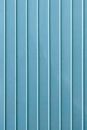 Vertical lines on blue wall
