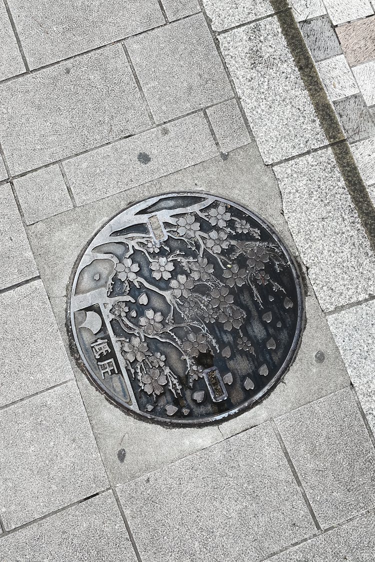 Manhole On Stone Masonry In Street