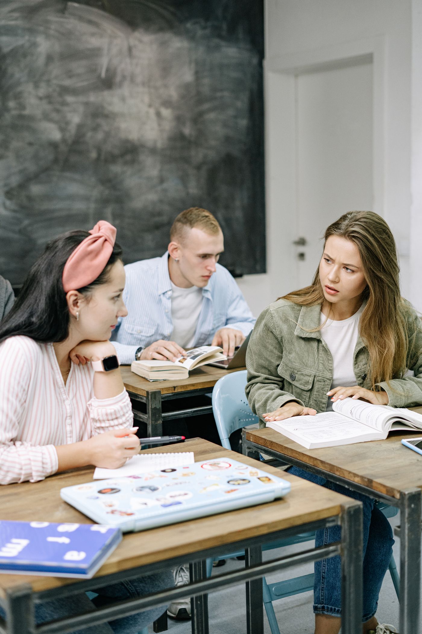 Secondary-age students engaged in a classroom discussion