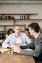 Male Colleagues talking with each other