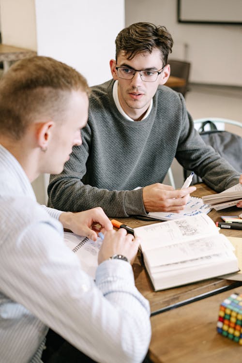 Free Two Men Studying Together Stock Photo