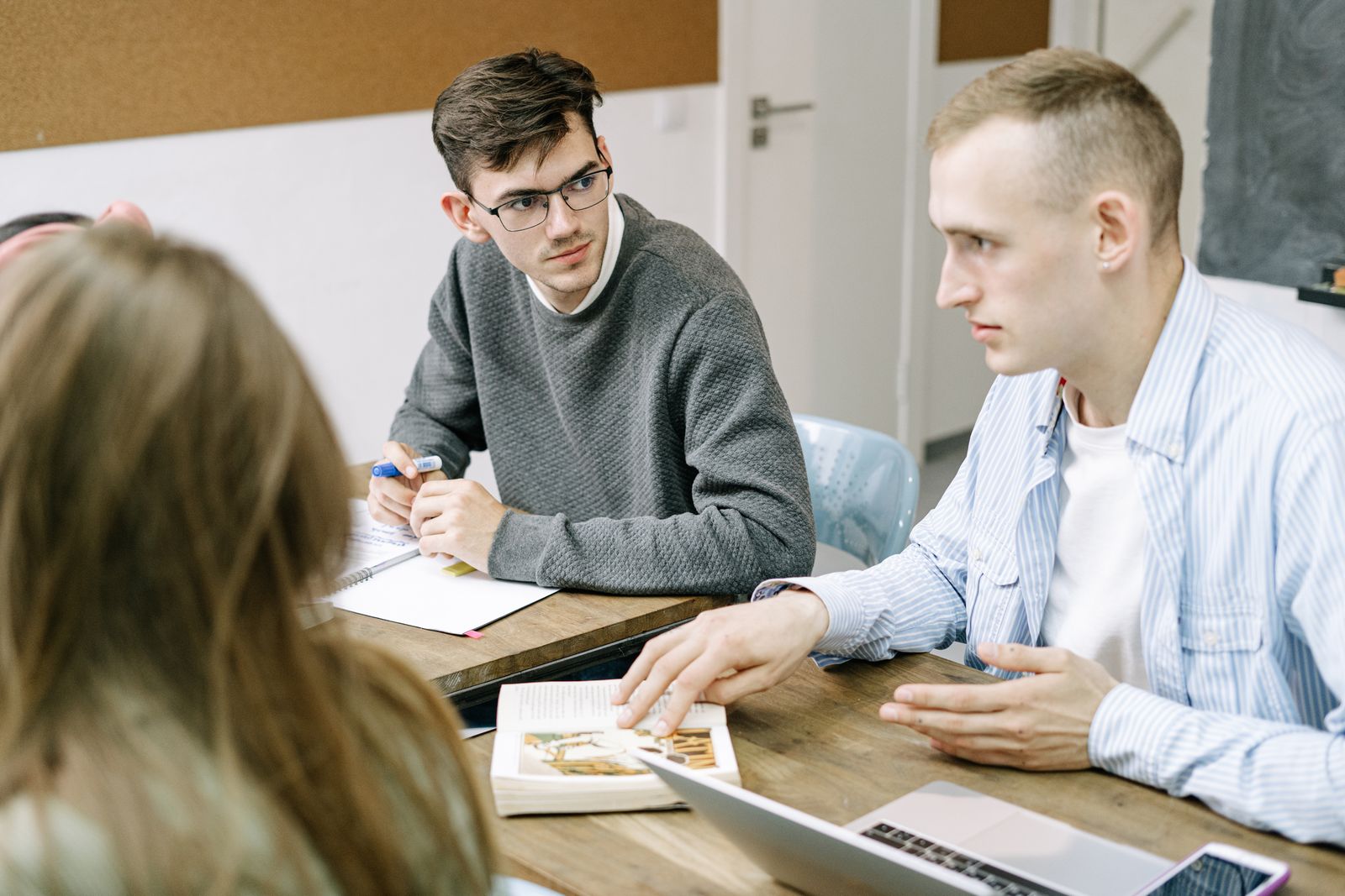 Professionals listening to each other during a focused group discussion