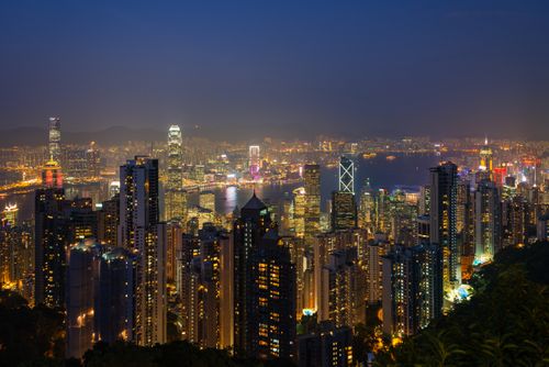 Free Breathtaking nighttime view of Hong Kong's vibrant skyline shining with city lights. Stock Photo