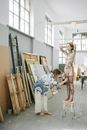 Woman with Body Paint Standing on a Stool