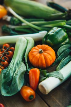 Vibrant assortment of fresh organic vegetables on a wooden table, perfect for healthy eating.