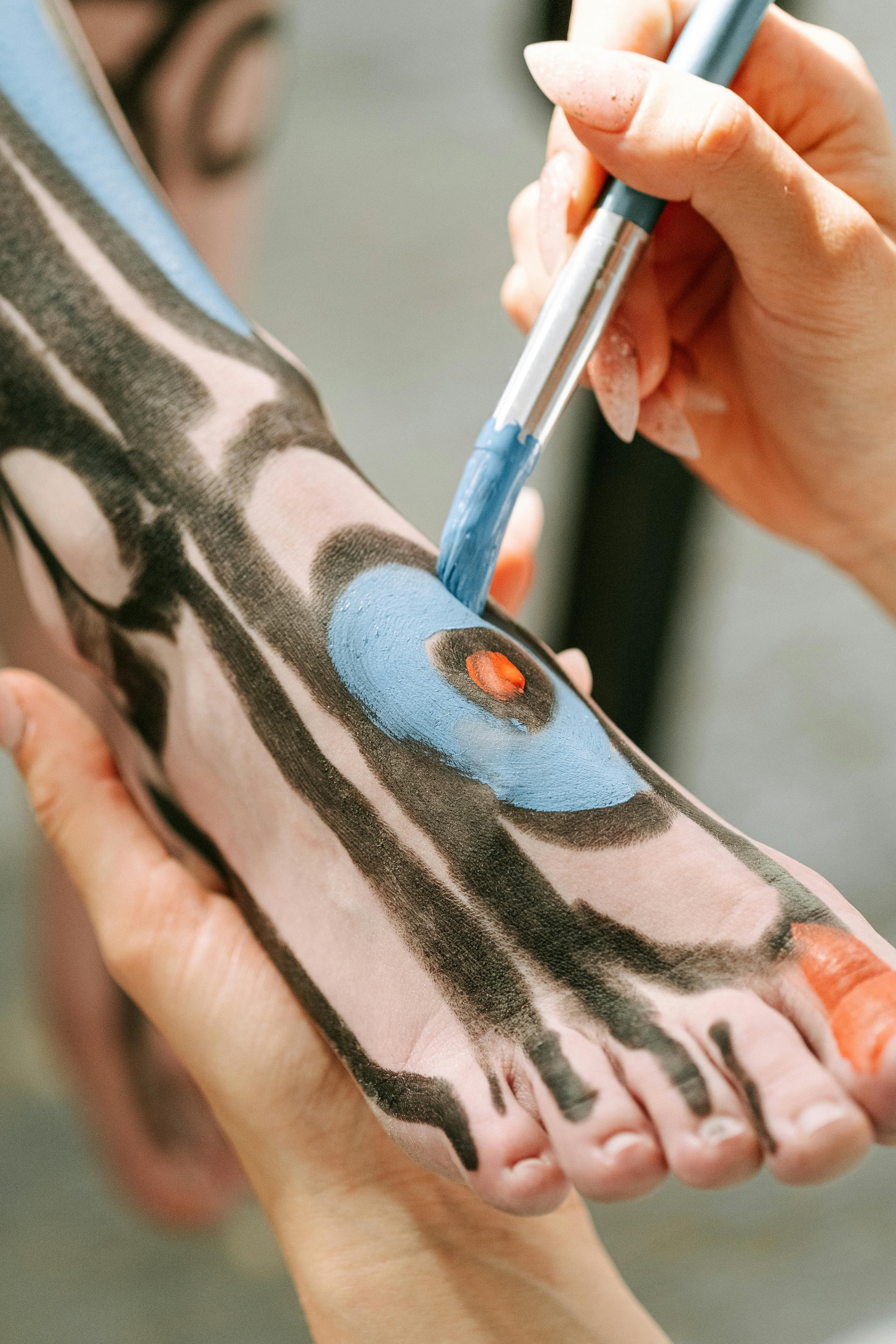 person holding blue ballpoint pen