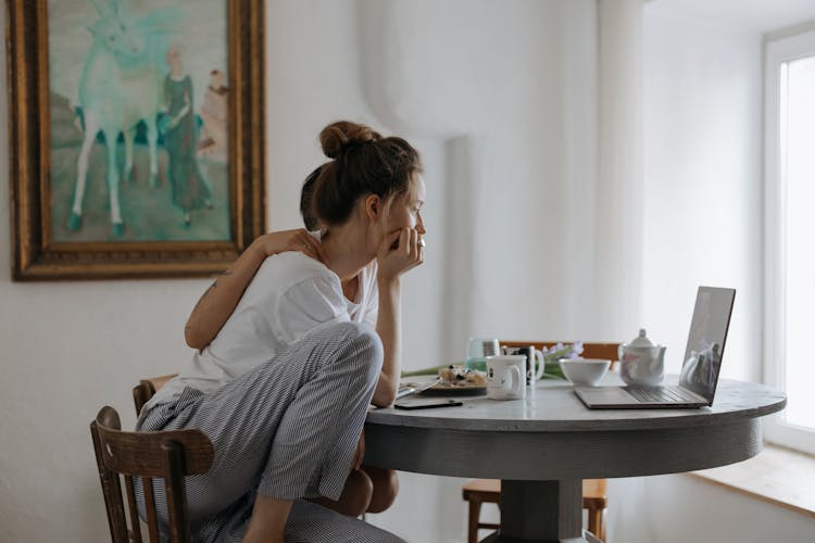 A Couple Sitting At The Table