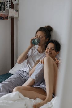 Relaxed couple enjoying a morning inside, depicting intimacy and comfort.