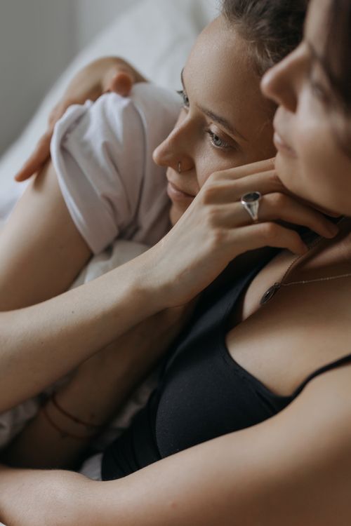 Free Close-up of a couple sharing an intimate embrace, showcasing love and tenderness. Stock Photo