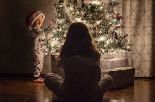 Photograph of Kids Near a Christmas Tree