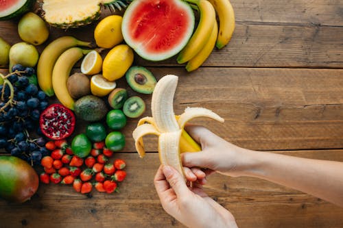 Person Peeling a Banana