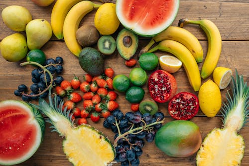 Close-Up Shot of Assorted Fruits on a Wooden Surface