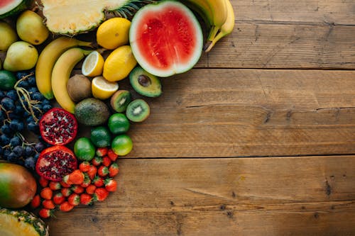 Close-Up Shot of Assorted Fruits on a Wooden Surface